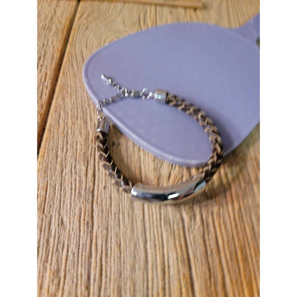 Leather and Silver Colored Metal Accent. Unisex